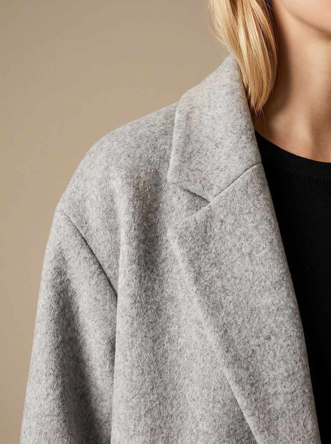 Women's tailored wool coat with lapels and double-breasted buttons, in a classic overcoat style by Homixa