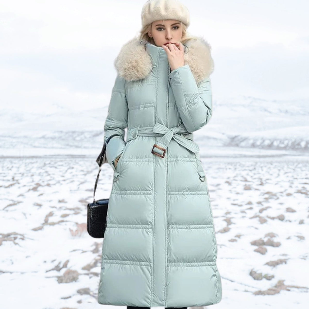 Women's longline quilted puffer parka by Homixa featuring a plush-trimmed hood and zip front, perfect for cold weather.