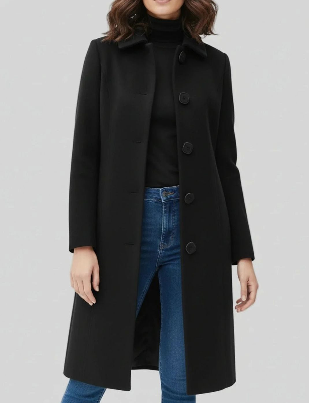 Women's longline winter coat by Homixa, single-breasted with button front and below-knee hem, suitable for cold weather.
