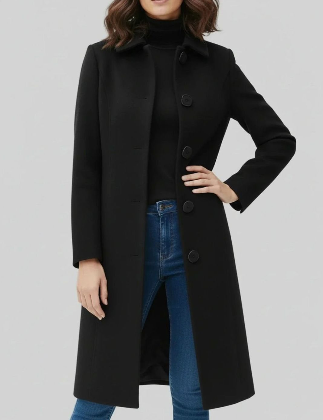 Women's longline winter coat by Homixa featuring a single-breasted button front and below-knee hem, perfect for cold weather.