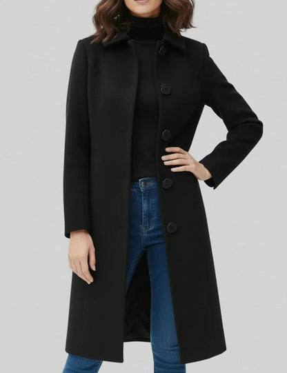 Women's longline winter coat by Homixa featuring a single-breasted button front and below-knee hem, perfect for cold weather.