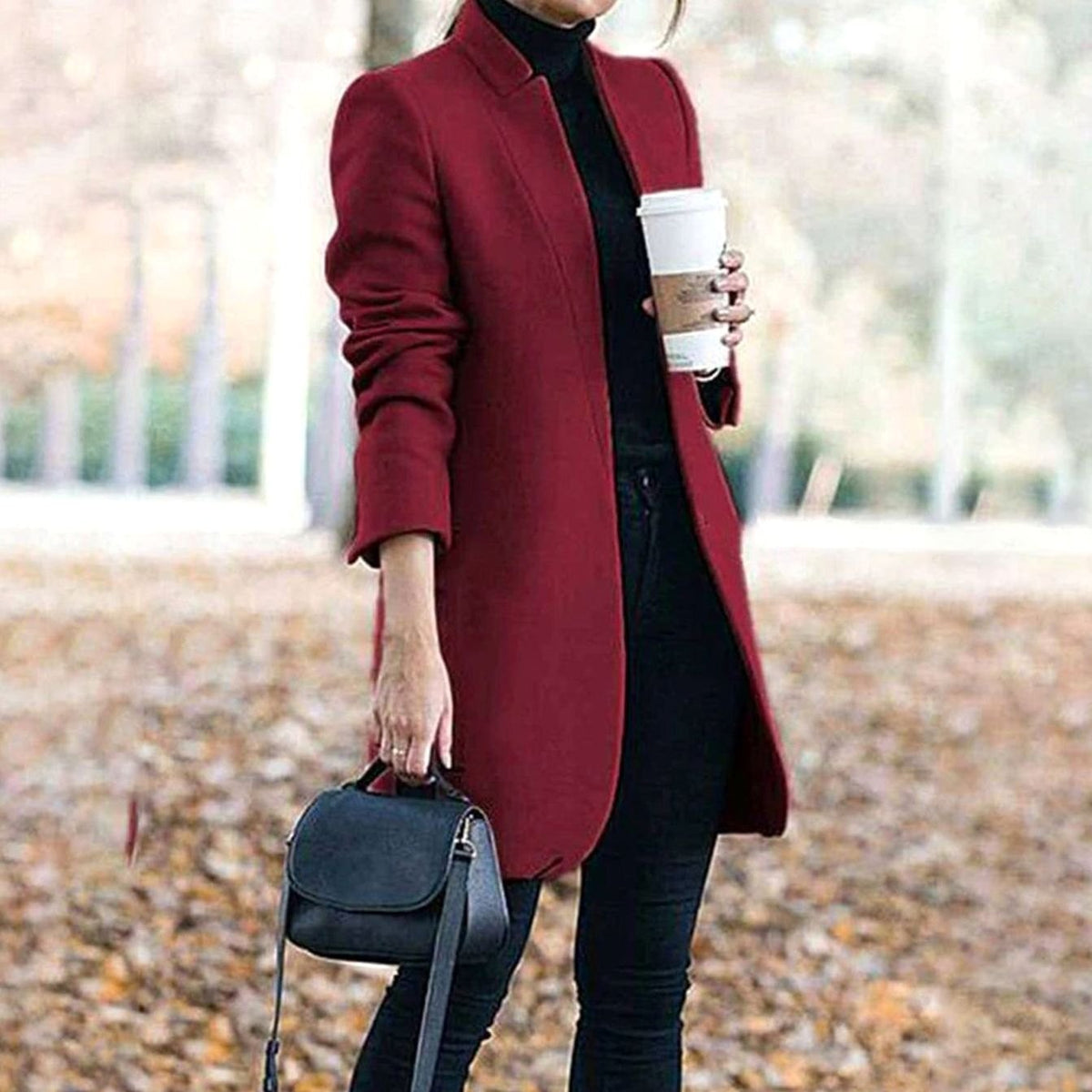 Women's longline winter jacket by Homixa with stand collar and slim, elegant silhouette, suitable for cold weather.