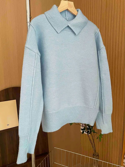Women's loose-fit knit sweater by Homixa featuring a stand collar and dropped shoulders, styled for a cozy, casual look.