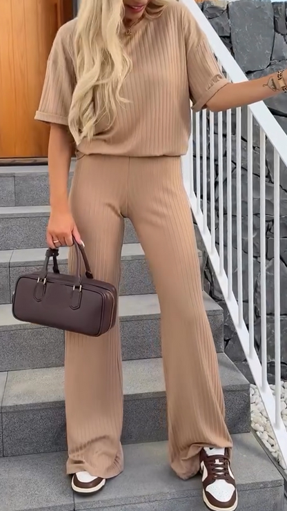 Women's lounge two-piece set by Homixa featuring a relaxed-fit top and straight-leg pants, shown in a comfortable, casual style.