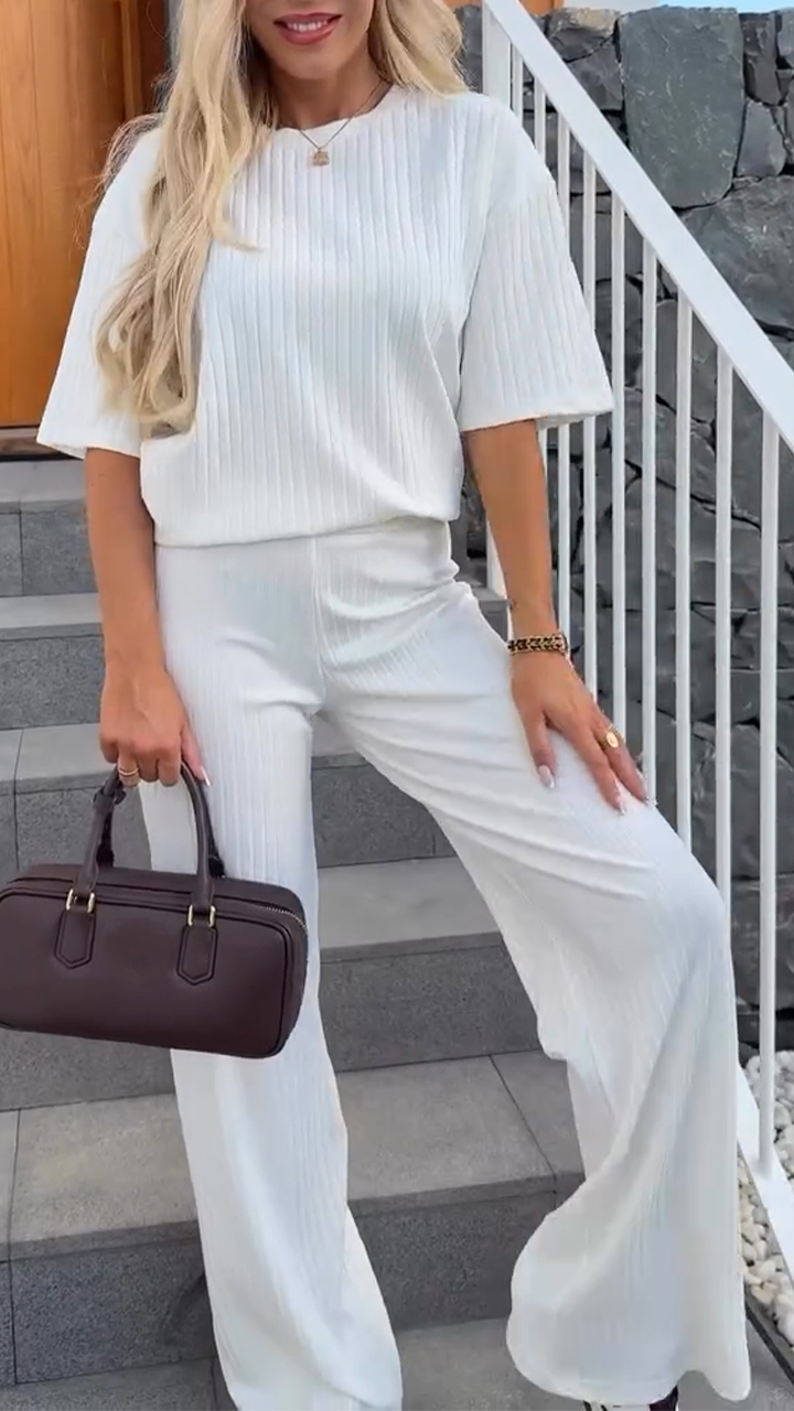 Homixa women's lounge two-piece set with relaxed-fit top and straight-leg pants, displayed on a hanger against a neutral background.