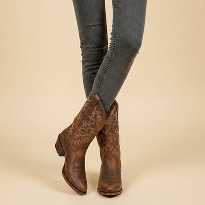 Women's mid-calf cowboy boots by Homixa with pointed toe, block heel, and tonal shaft embroidery, showcasing western style and craftsmanship.