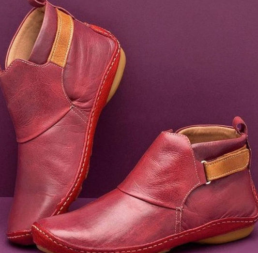 Women’s orthopedic leather slip-on booties by Homixa with soft upper and slip-resistant sole, ideal for comfortable everyday wear.