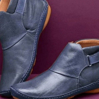 Women's Homixa orthopedic leather slip-on booties with soft upper and slip-resistant sole, designed for comfort and support.