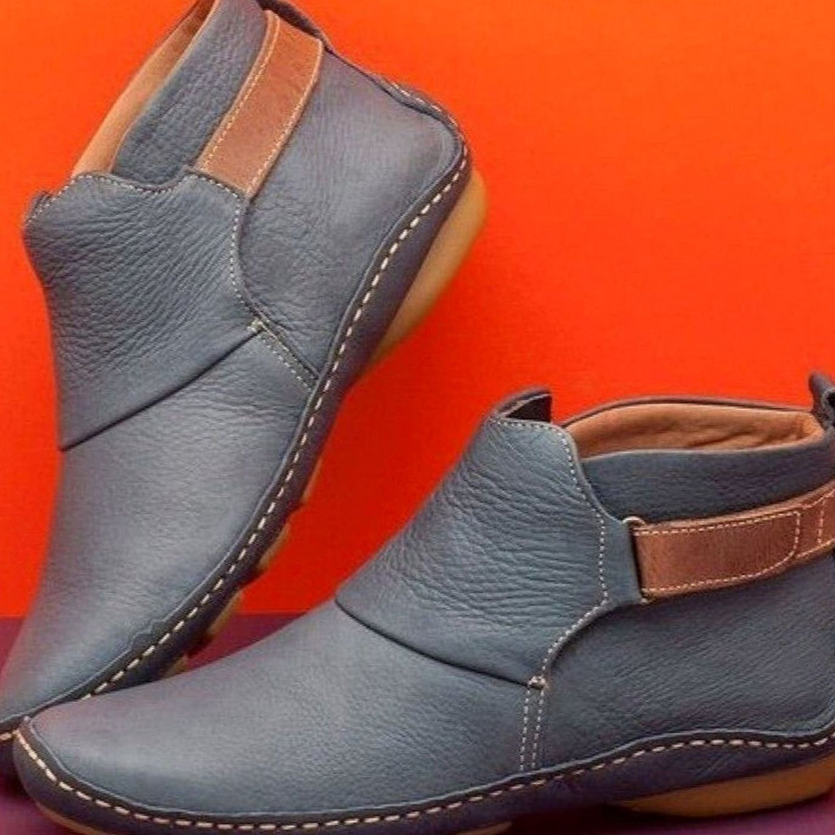 Women's Homixa orthopedic leather slip-on booties with soft upper and slip-resistant sole, designed for comfort and support.