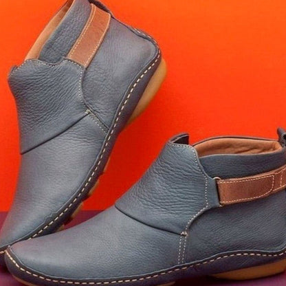 Women's Homixa orthopedic leather slip-on booties with soft upper and slip-resistant sole, designed for comfort and support.