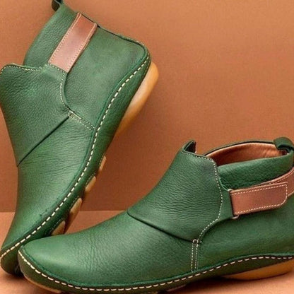 Women's Homixa orthopedic leather slip-on booties with soft upper and slip-resistant sole, ideal for comfortable everyday wear.