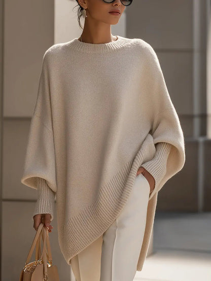 Women’s oversized batwing-sleeve knit sweater by Homixa with flowing drape and soft, cozy fabric, shown on a model.