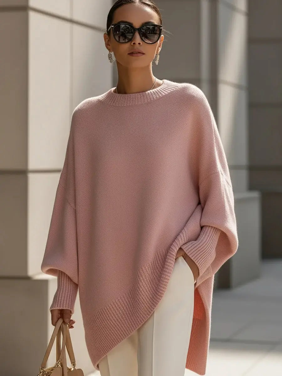 Women's oversized batwing-sleeve knit sweater with flowing drape and soft texture, by Homixa, displayed on a model.