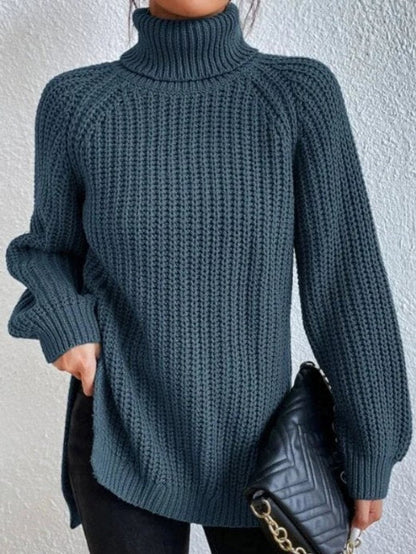 Women's oversized chunky-knit turtleneck sweater by Homixa with wide ribbed cuffs, cozy and stylish for casual wear.