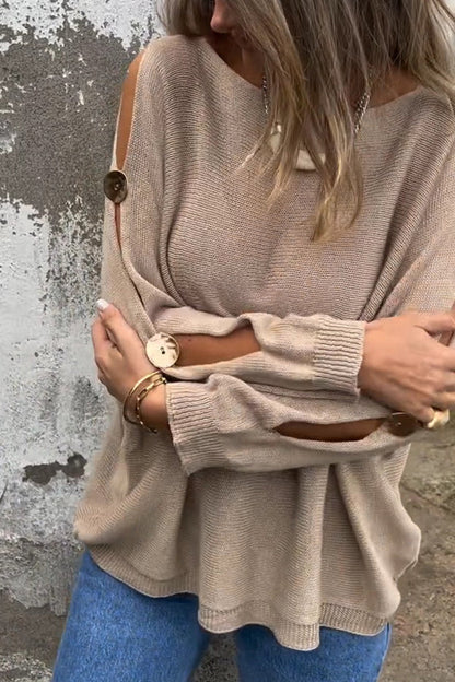 Women’s oversized crew-neck sweater by Homixa featuring cutout sleeves and button details, shown in a cozy knit fabric.