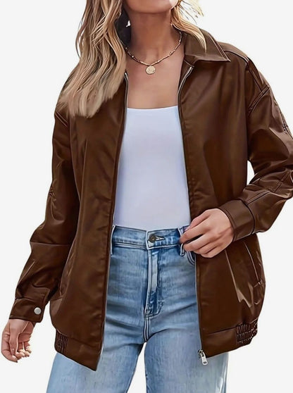 Women’s oversized faux-leather bomber jacket by Homixa with side pockets, elastic hem, and pointed collar, stylish and trendy outerwear.