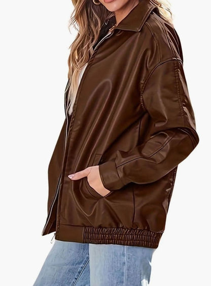 Women's oversized faux-leather bomber jacket with side pockets, elastic hem, and pointed collar by Homixa.