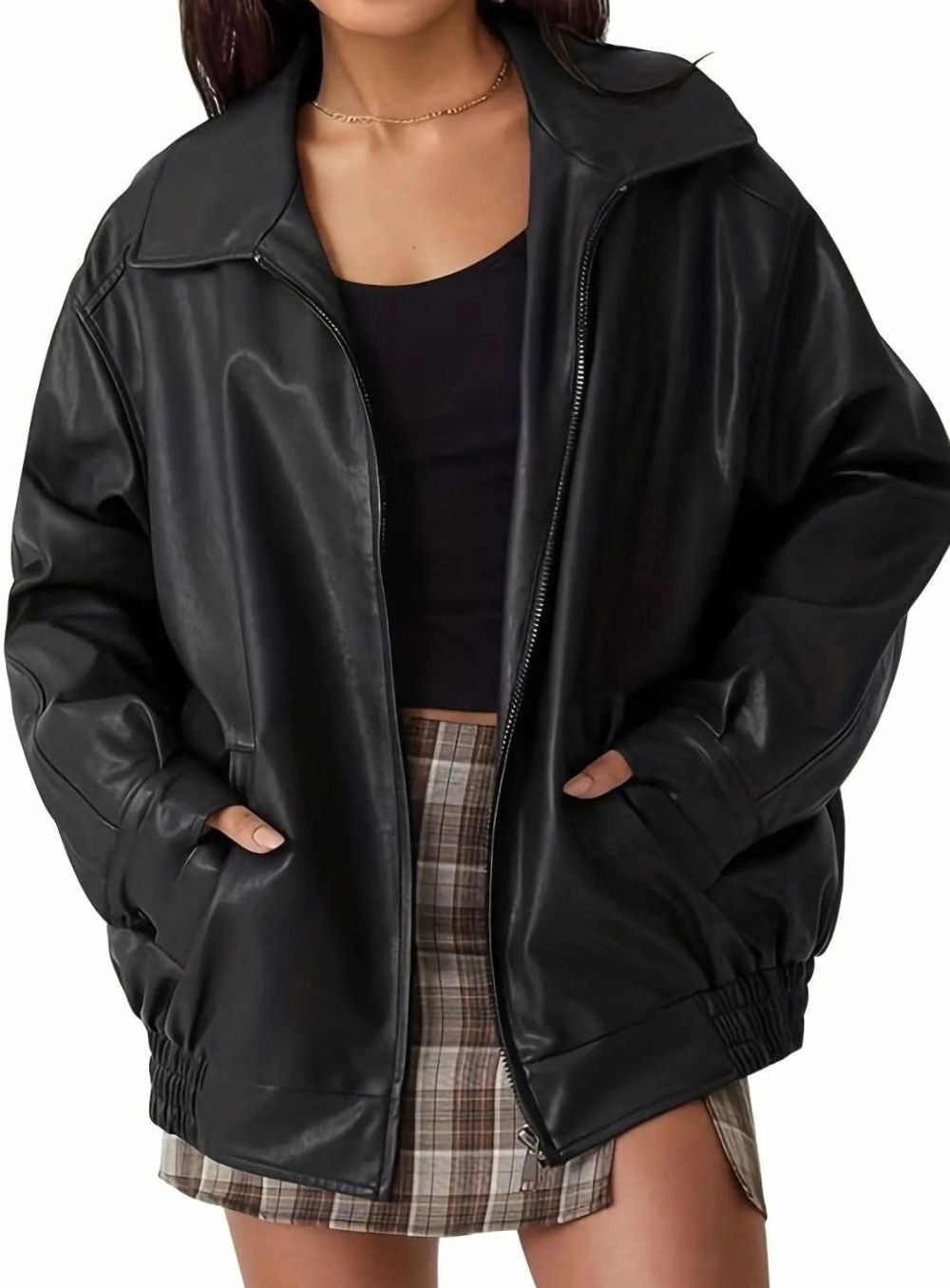 Women's oversized faux-leather bomber jacket by Homixa with side pockets, elastic hem, and pointed collar, styled on a model.