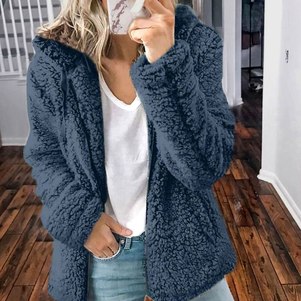 Women's oversized teddy coat by Homixa featuring textured faux-fur fabric, hood, and full zip front for cozy winter style.