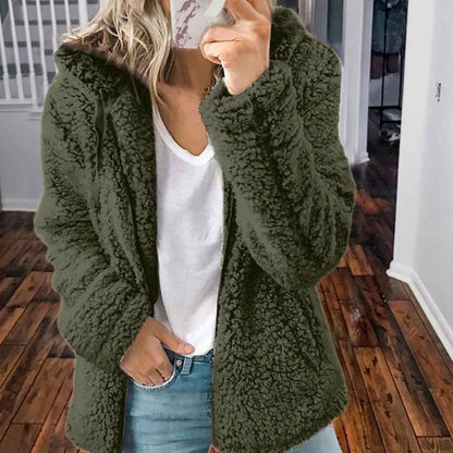 Women’s oversized teddy coat by Homixa with textured faux-fur fabric, hood, and full zip closure, shown in a cozy, plush design.