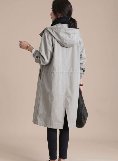 Women’s oversized hooded trench coat by Homixa, Korean-inspired midlength design with a stylish, relaxed fit and hooded detail.