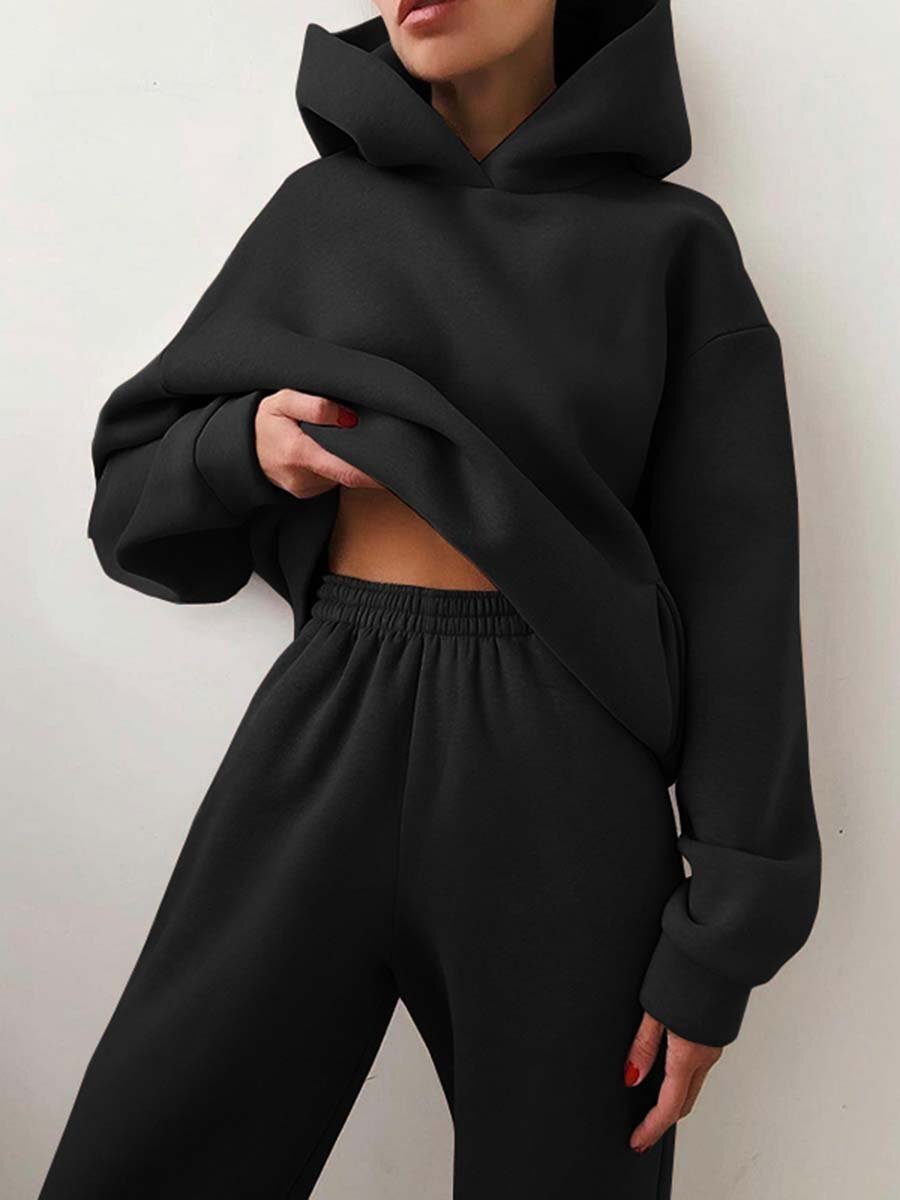 Women's oversized knit hoodie and jogger set by Homixa, featuring soft fleece, elastic waist, and relaxed fit for comfort.