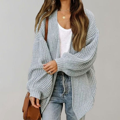 Women’s oversized open-front cardigan by Homixa with chunky waffle knit and relaxed fit, shown draped on a model.
