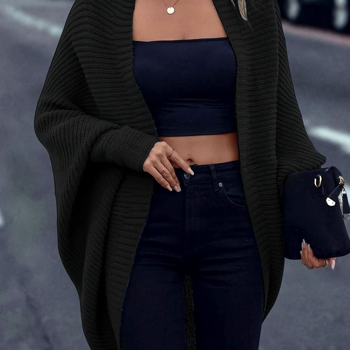 Women's oversized open-front cardigan by Homixa with longline cut and batwing sleeves, shown draped on a model.