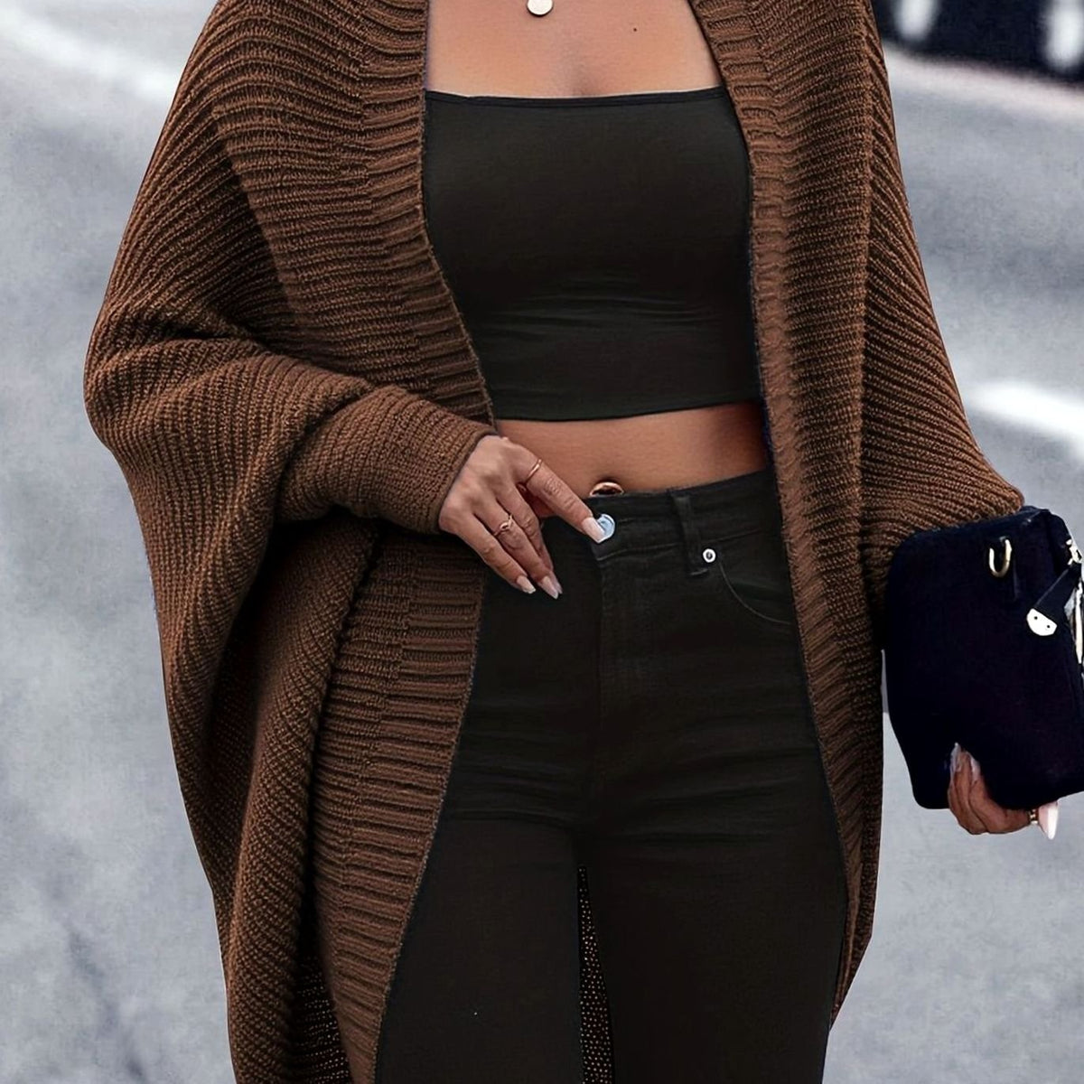 Women's oversized open-front cardigan by Homixa with longline cut and batwing sleeves, styled casually on a model.