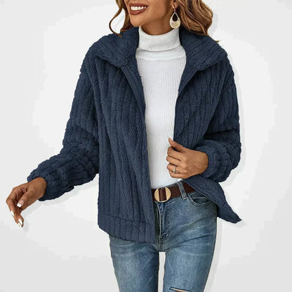 Women's oversized quilted fleece coat by Homixa with zip-up front, ribbed cuffs, and spread collar, shown on a model.
