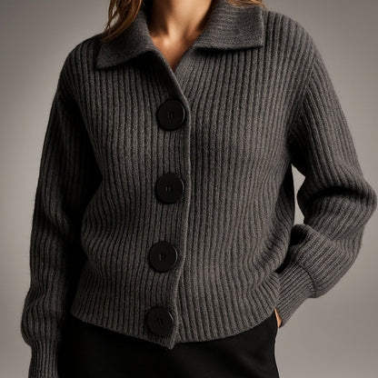 Women's oversized ribbed knit cardigan by Homixa with wide collar and large black buttons, shown on a model.