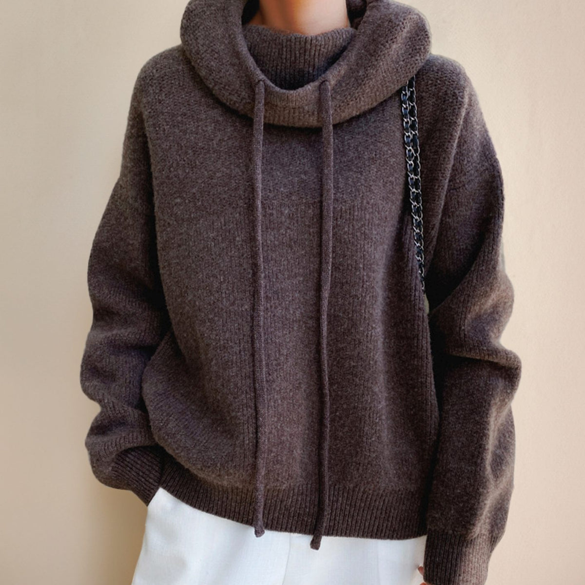 Women's oversized soft-knit sweater with hood and adjustable drawstring, cozy and stylish by Homixa.