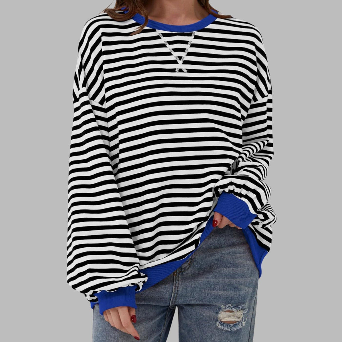 Women's oversized striped sweatshirt by Homixa featuring contrast ribbed cuffs and collar, casual and comfortable fit.