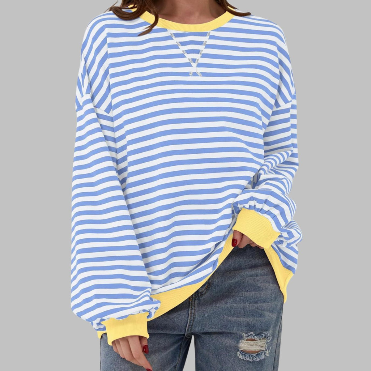 Women's oversized striped sweatshirt by Homixa featuring contrast ribbed cuffs and collar, casual and comfortable fit.
