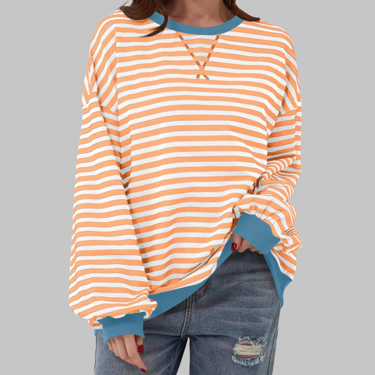 Women's oversized striped sweatshirt by Homixa featuring contrast ribbed cuffs and collar, displayed on a model.
