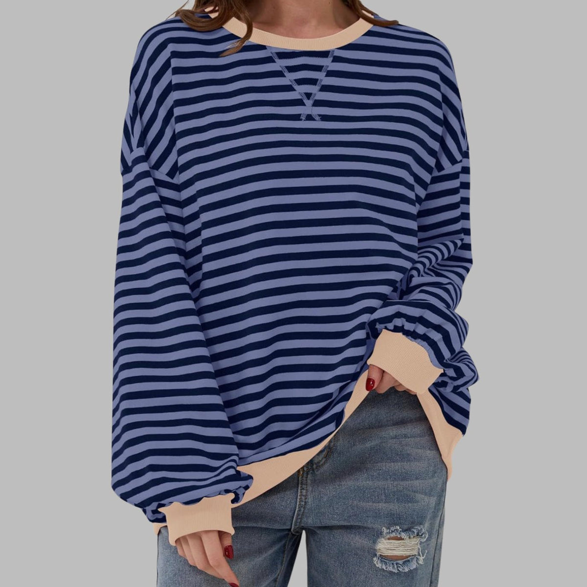 Women's oversized striped sweatshirt by Homixa featuring contrast ribbed cuffs and collar, casual and comfortable for everyday wear.