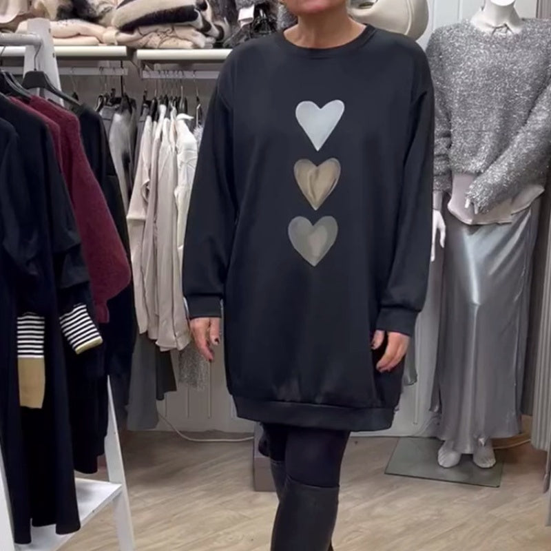 Women’s oversized sweatshirt dress by Homixa with stacked heart graphic and ribbed hem, casual and comfortable fashion piece.