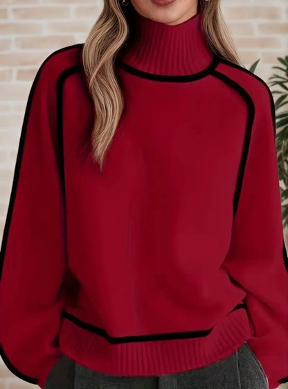 Women's oversized two-tone knit turtleneck sweater with raglan sleeves by Homixa, showing the cozy, stylish design in natural pose.
