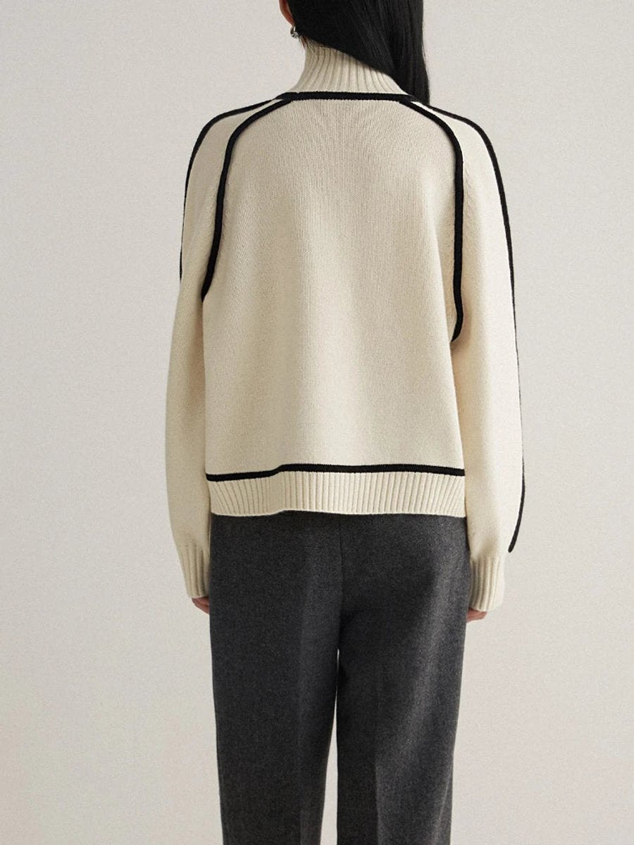Women's oversized two-tone knit turtleneck sweater with raglan sleeves by Homixa, showcasing a cozy, stylish design.