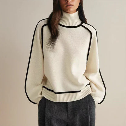 Women's oversized two-tone knit turtleneck sweater with raglan sleeves by Homixa, showcasing a cozy, stylish design and contrasting colors.