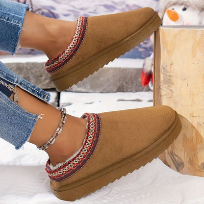 Women's plush-lined slip-on winter slippers by Homixa with boho trim and rubber sole for cozy indoor warmth.
