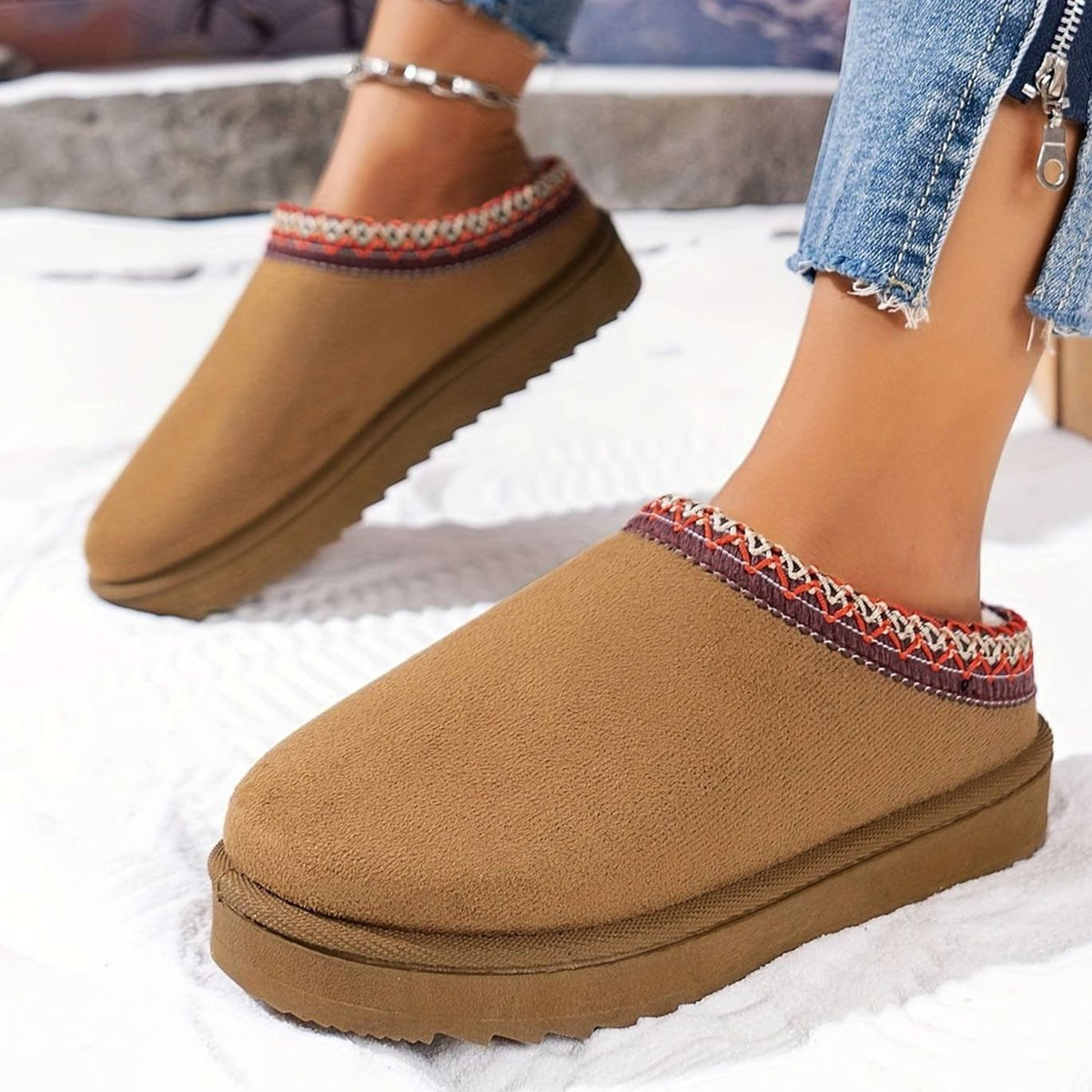 Homixa women's plush-lined slip-on winter slippers with boho trim and rubber sole, cozy and stylish for cold weather.