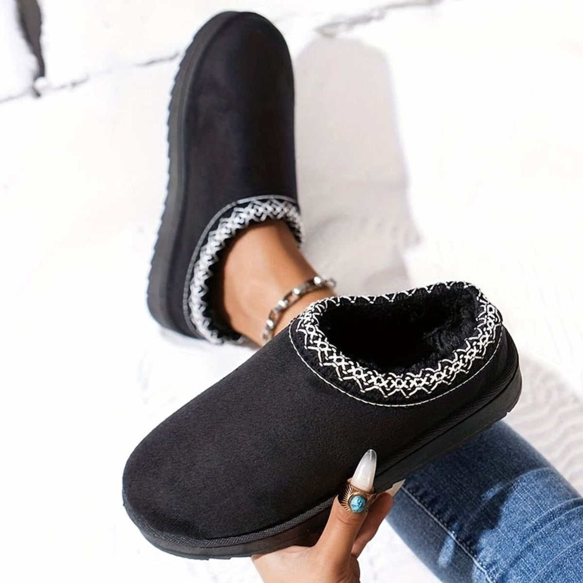 Women's plush-lined slip-on winter slippers by Homixa with boho trim and rubber sole, showing cozy interior and stylish design.