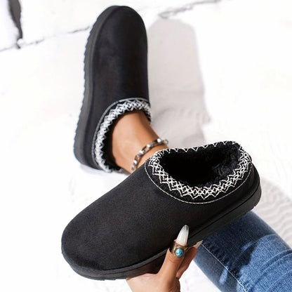 Women's plush-lined slip-on winter slippers by Homixa with boho trim and rubber sole, showing cozy interior and stylish design.