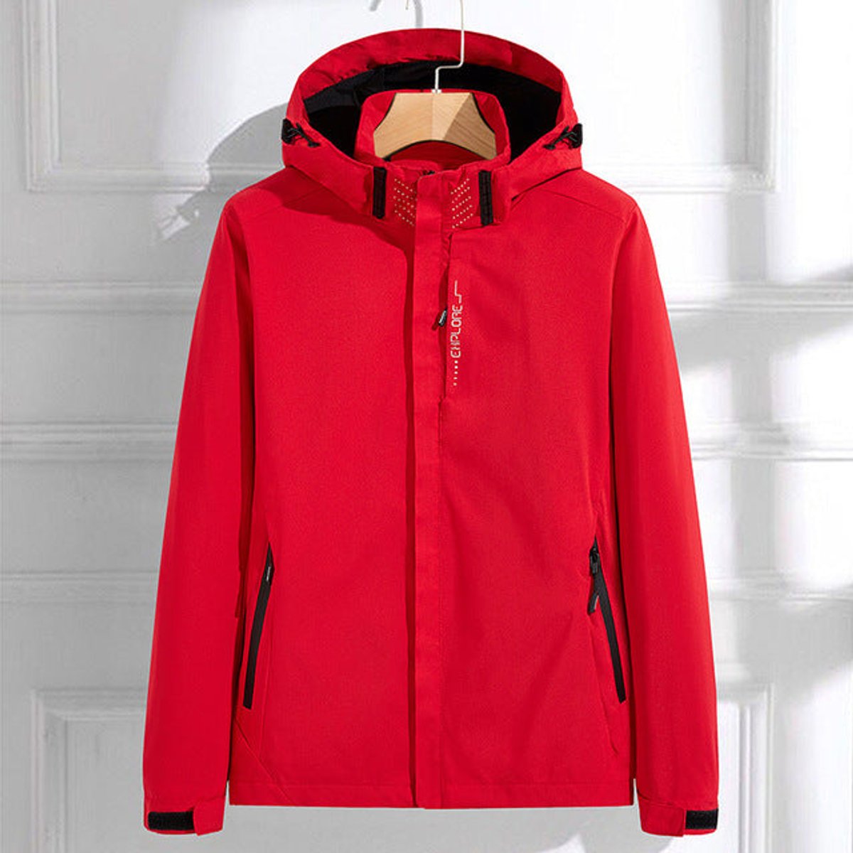 Women’s polyester rain jacket by Homixa featuring a removable hood, double zip closure, and adjustable fit for weather protection.