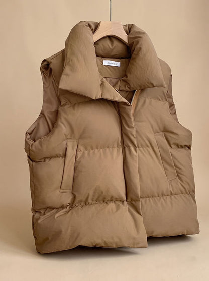 Women's quilted boxy-fit puffer vest with shawl collar and two-way zipper by Homixa, displayed on a mannequin.