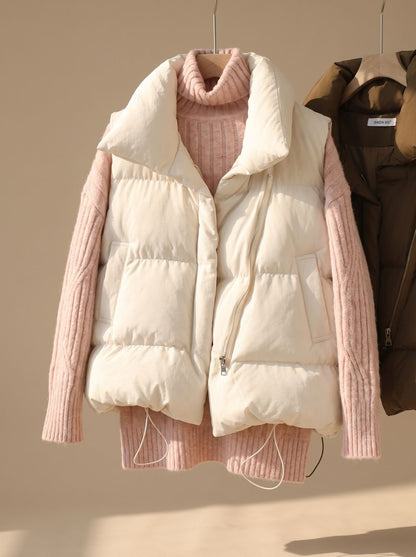 Women's quilted boxy-fit puffer vest by Homixa with shawl collar and two-way zipper, shown on a model.
