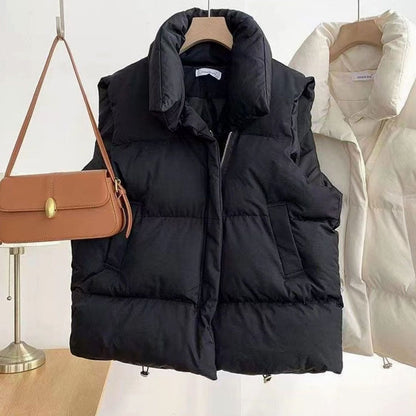 Women's quilted boxy-fit puffer vest with shawl collar and two-way zipper by Homixa, shown on a model.
