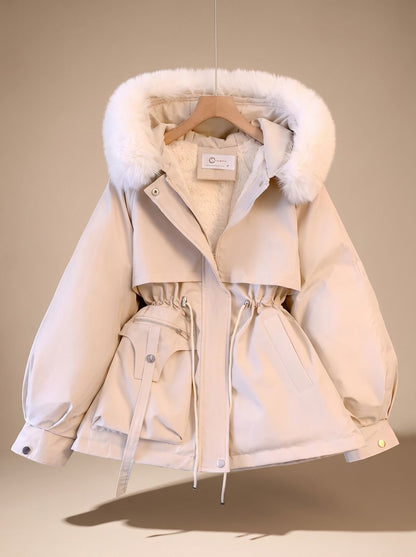 Women's quilted winter jacket with fur collar, hood, and adjustable drawstring waist by Homixa. Cozy and stylish outerwear.