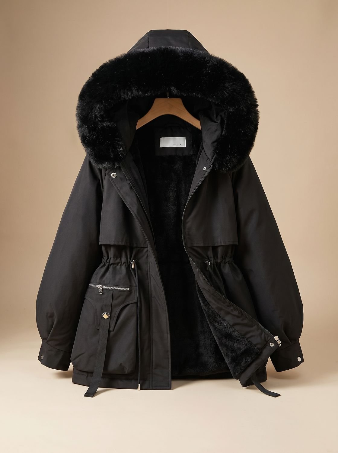 Women's quilted winter jacket by Homixa featuring a fur collar, hood, and adjustable drawstring waist for warmth and style.
